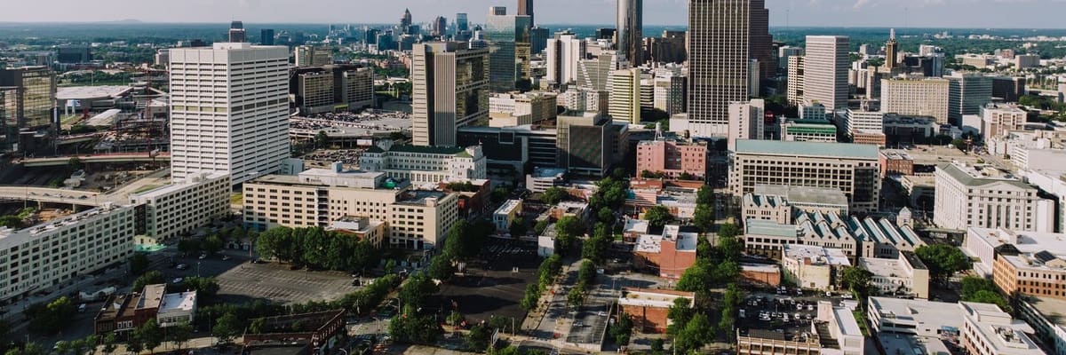 Aerial view of the Atlanta, Georgia skyline under a clear blue sky