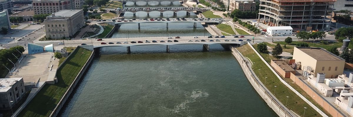 Aerial view of downtown Des Moines, Iowa, with the river and bridges on a clear day