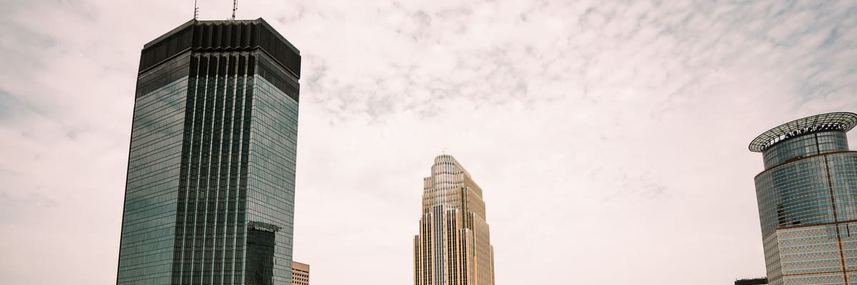 Glass skyscrapers of downtown Minneapolis, Minnesota, rising into a pale sky