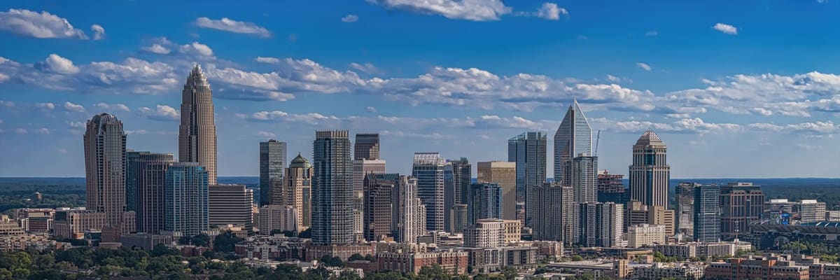 The Charlotte, North Carolina skyline and highways on a sunny summer day